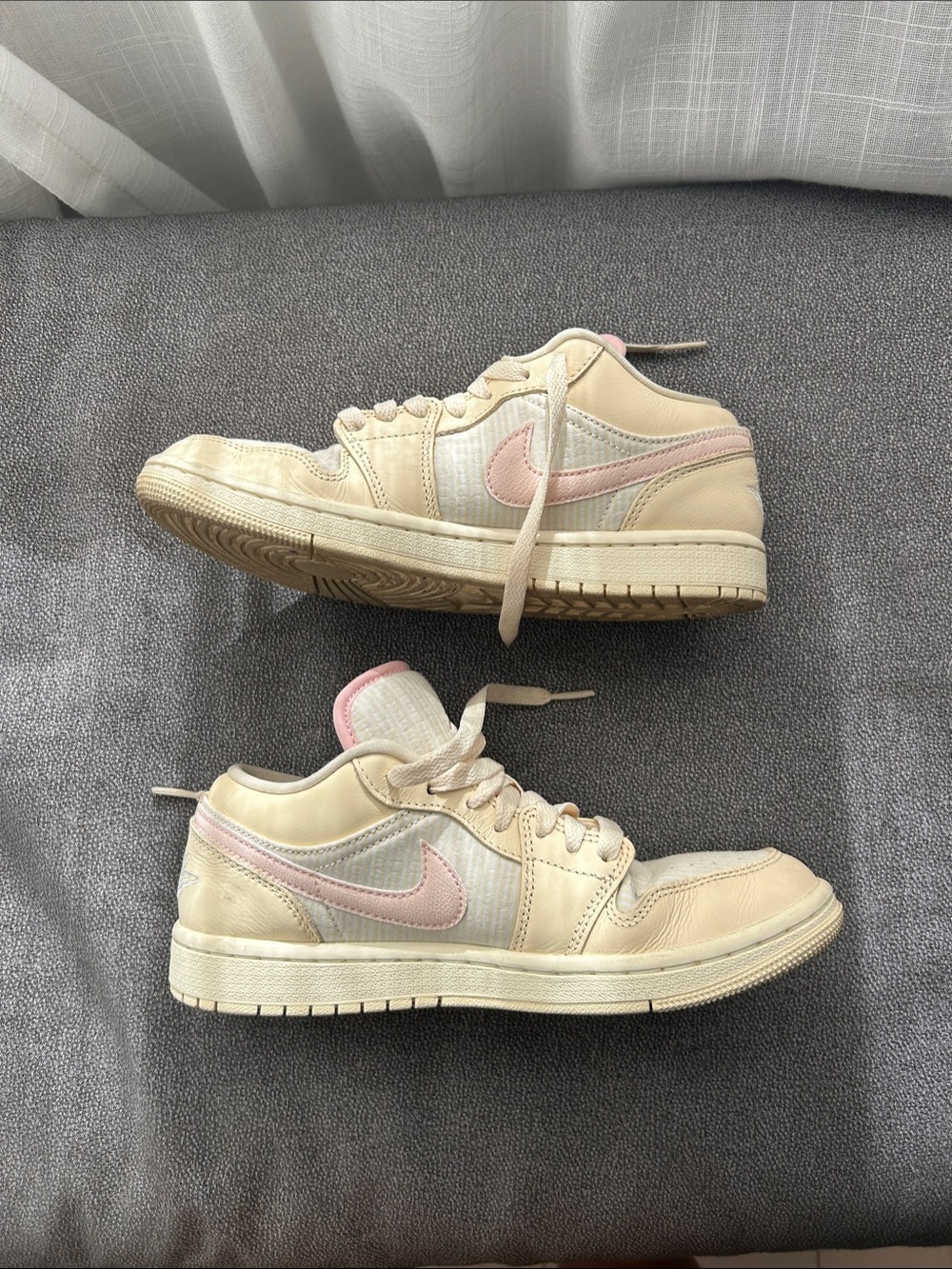 Nike Women’s Low-Top Sneakers in Cream with Pink Swoosh